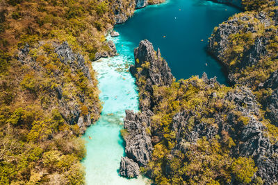 High angle view of rocks by sea