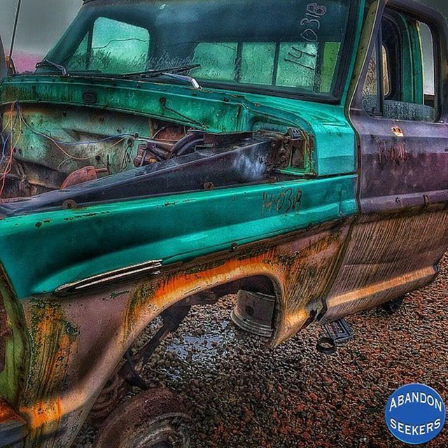 transportation, mode of transport, built structure, architecture, land vehicle, building exterior, old, no people, abandoned, outdoors, day, arch, obsolete, travel, blue, metal, rusty, part of, damaged, car