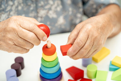 Midsection of man with toy blocks