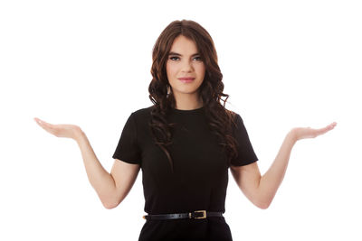 Portrait of a smiling young woman against white background