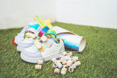 High angle view of multi colored toys on grass