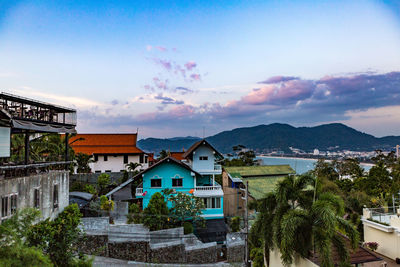 Houses in town against sky