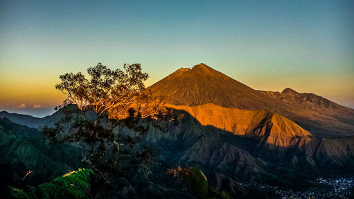 Scenic view of mountain against sky during sunset