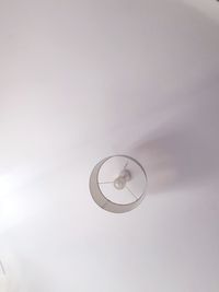 Low angle view of lamp against ceiling