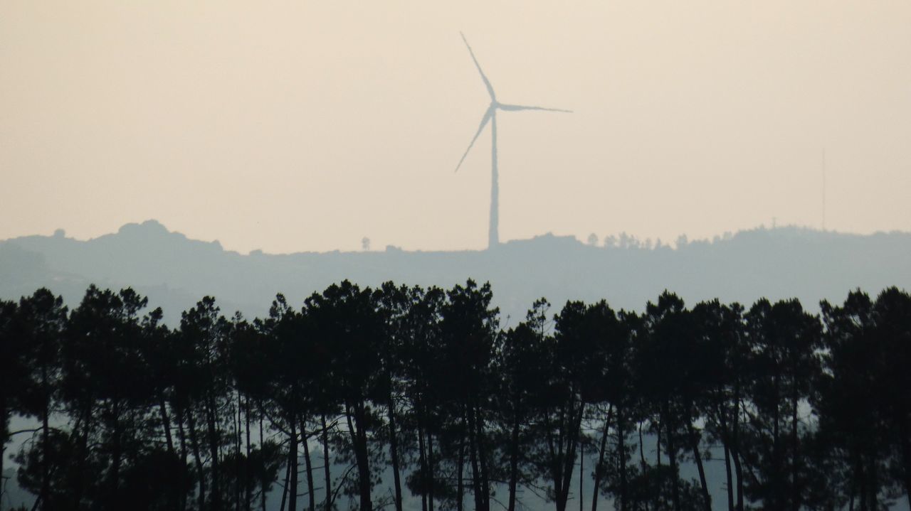 PANORAMIC VIEW OF WIND TURBINES ON LAND