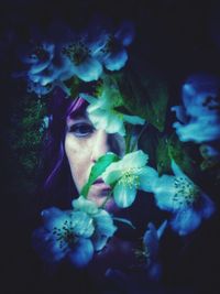 Portrait of woman with pink flowers