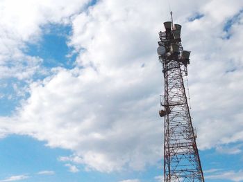 Low angle view of communications tower against sky