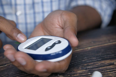 Young man measuring diabetic