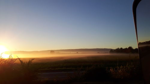 Scenic view of landscape at sunset