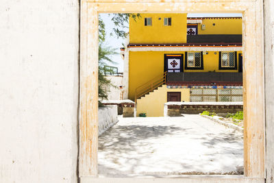 Empty alley amidst buildings in city