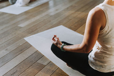 Woman meditating in yoga studio