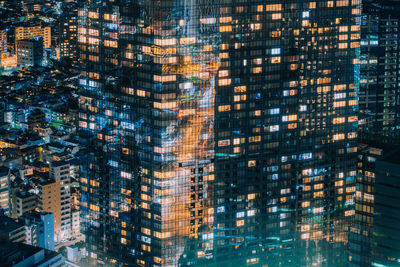 Full frame shot of modern buildings at night