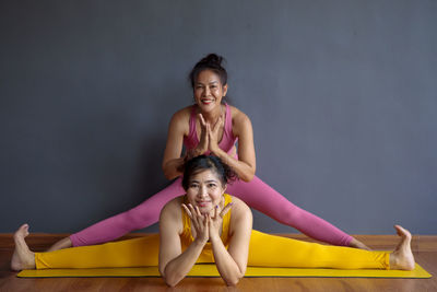 Portrait of women doing splits