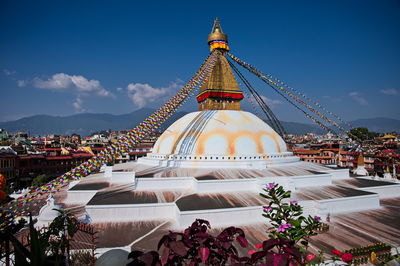 Swoyembunath stupa with prayer flags from the top roof restaurant in kathmandu, nepal