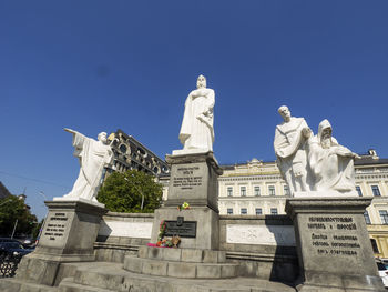 Low angle view of statue against building