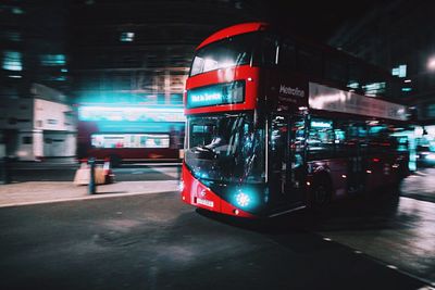 View of bus on road at night