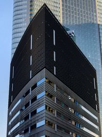 Low angle view of modern building against clear sky