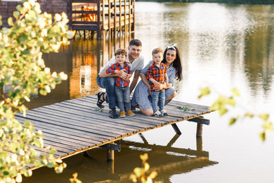 Young couple sitting on the lake