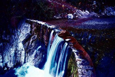 Scenic view of waterfall in forest