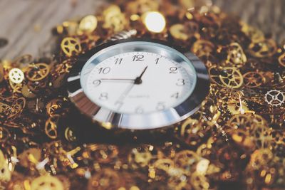 Close-up of pocket watch and clockwork parts