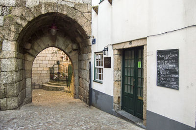 Alley amidst buildings in city