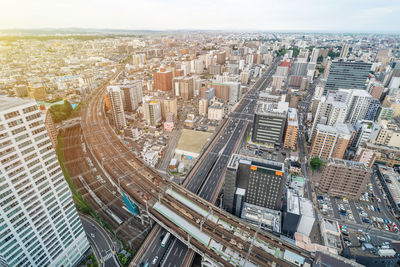 High angle view of modern buildings in city against sky