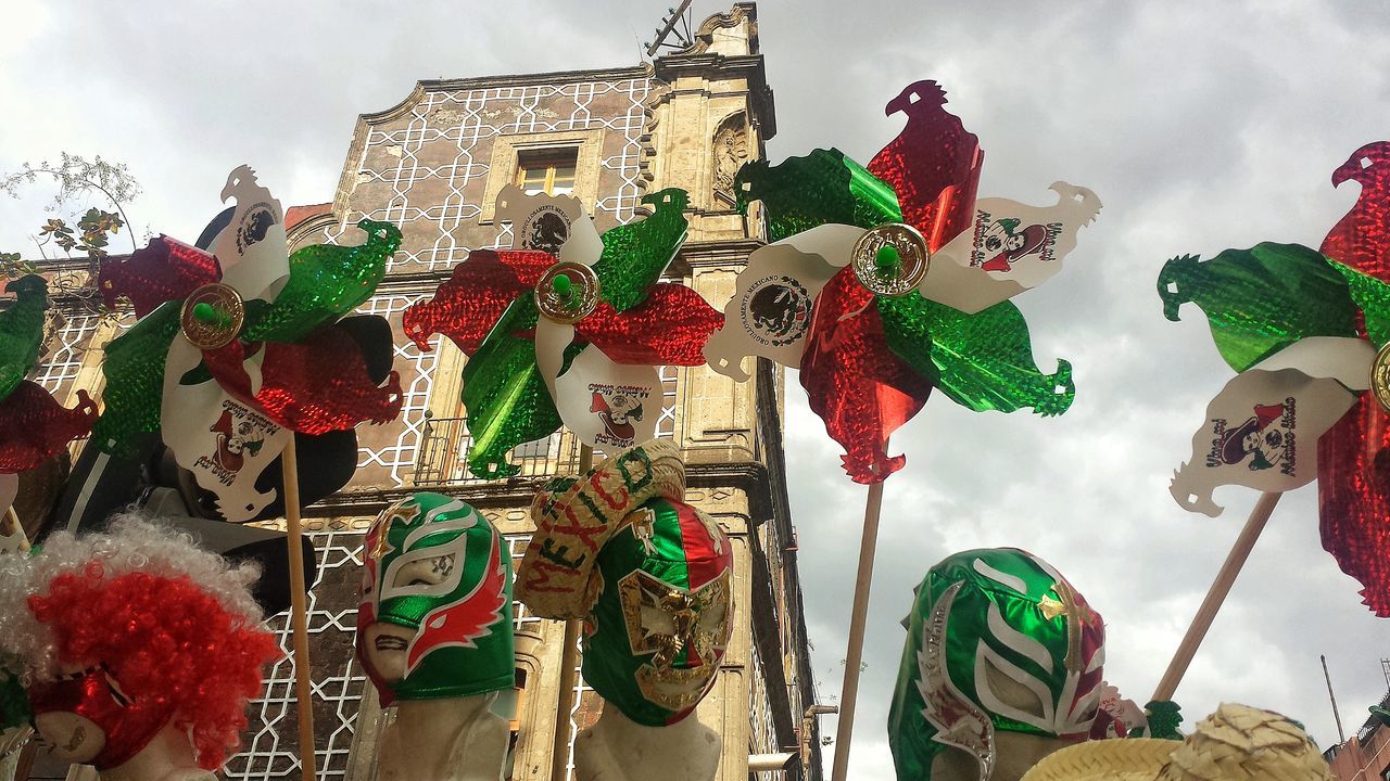 LOW ANGLE VIEW OF VARIOUS LANTERNS HANGING ON WALL