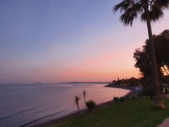 Scenic view of sea against sky at sunset