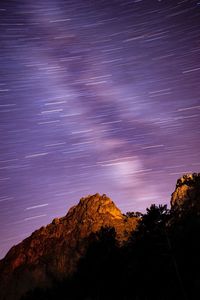 Low angle view of mountain against sky at night