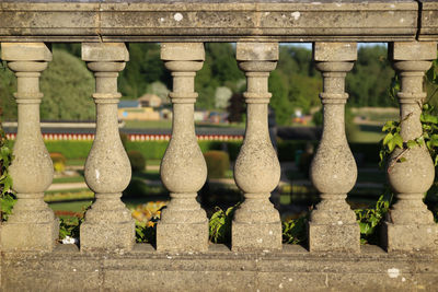 Close-up of railing against stone wall