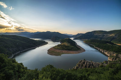 Scenic view of lake against sky during sunset