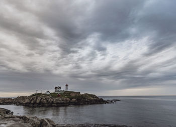 Moody cloudy stormy gray day at nubble light, york, maine