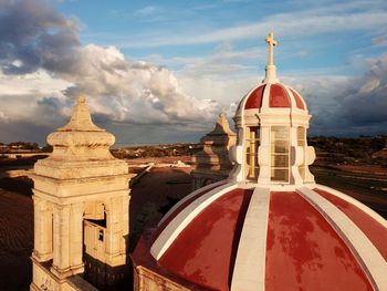 Church against sky in city