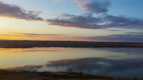 Scenic view of landscape against cloudy sky