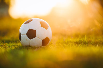 Close-up of soccer ball on field