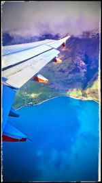 Aerial view of landscape against cloudy sky