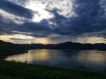 Scenic view of lake against sky during sunset