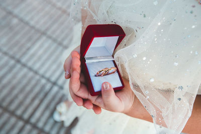 Cropped hand of woman using mobile phone