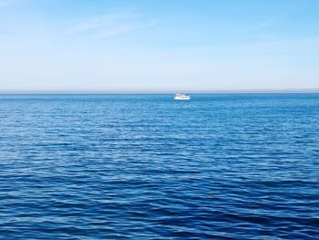 Sailboat sailing in sea against sky