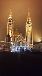 View of illuminated cathedral against sky at night