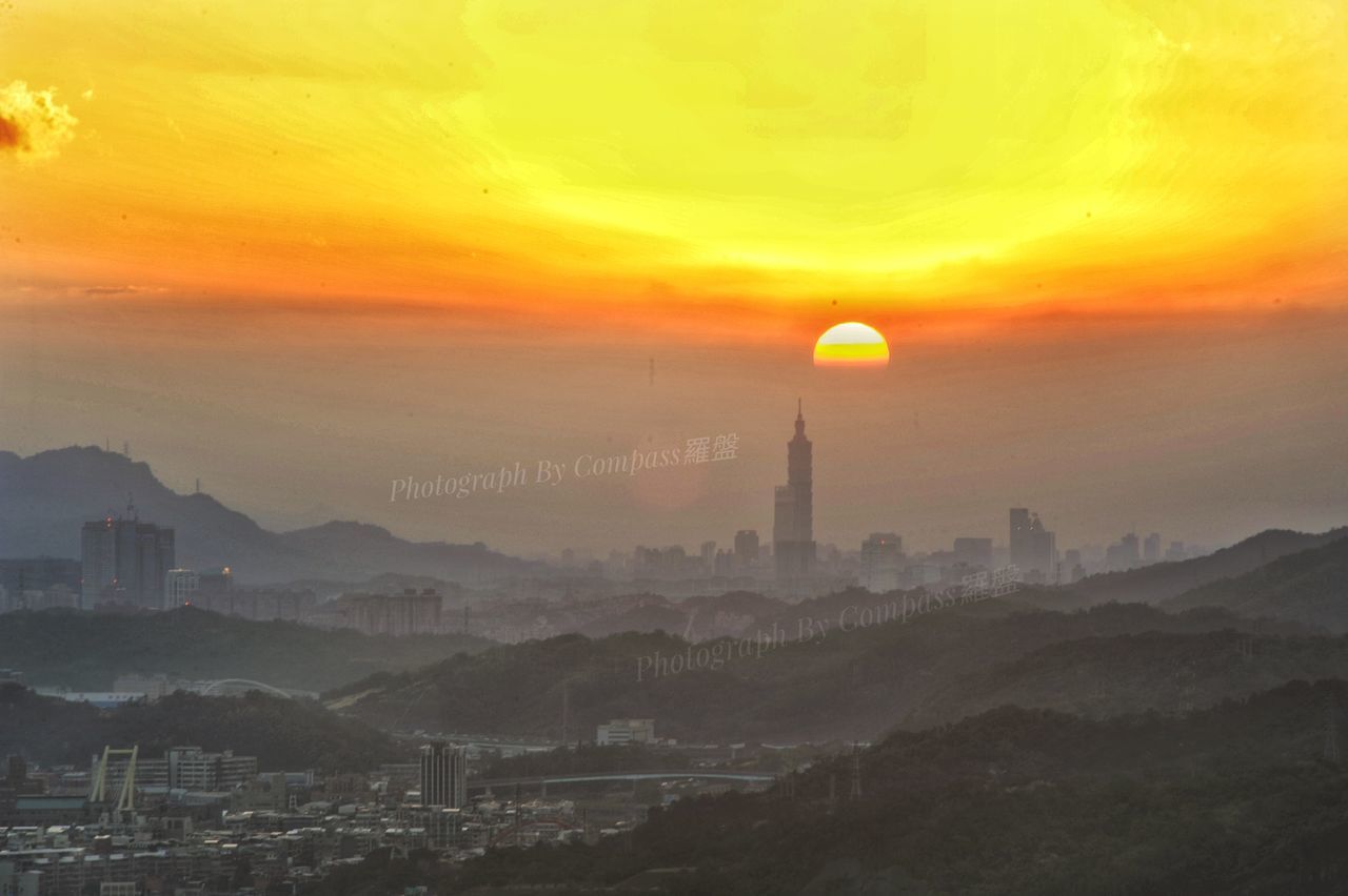 architecture, sunset, building exterior, built structure, sky, city, travel destinations, mountain, fog, cityscape, no people, nature, outdoors, beauty in nature, cloud - sky, scenics, skyscraper, day