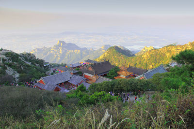 High angle view of houses and trees against sky