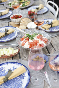 High angle view of fresh cheese and meat in bowl on table