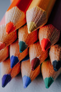 Close-up of multi colored pencils on table