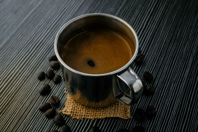 High angle view of coffee cup on table