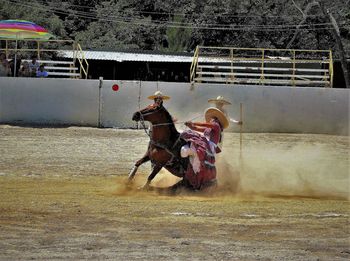 Full length of man riding horse