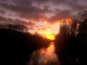 Scenic view of lake against cloudy sky