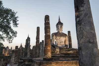 Low angle view of temple against building