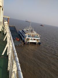 High angle view of ship by sea against sky