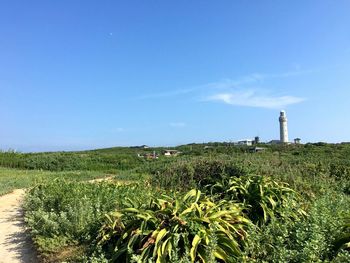 Scenic view of lighthouse against blue sky